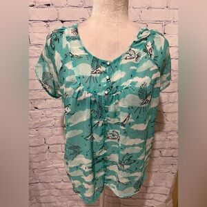 Kirra Sheer shirt Light blue with bird design And Buttons up front. Small